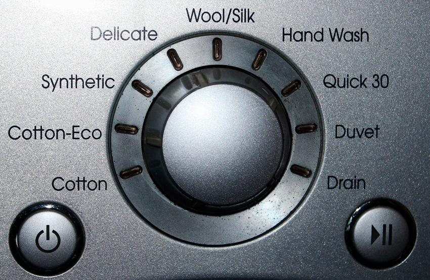 botones de una lavadora secadora